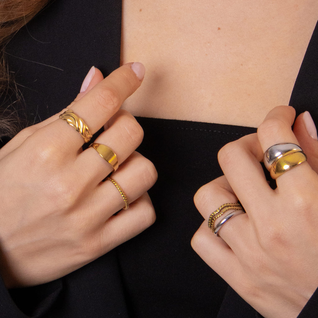 Braided gold ring with intricate woven texture