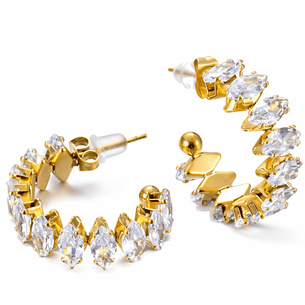 Gold hoop earrings with clear crystal stones in a curved design
