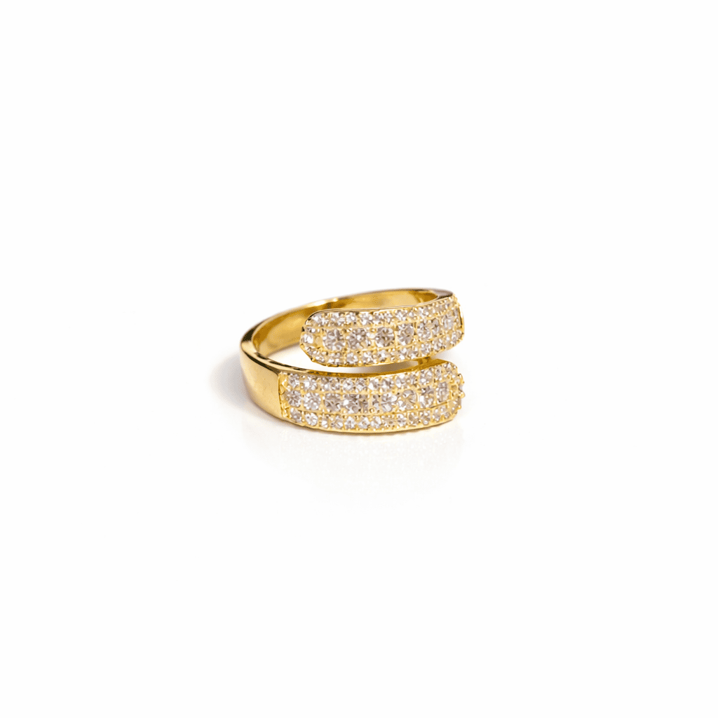 Gold double band ring with pavé-set crystals on a white background
