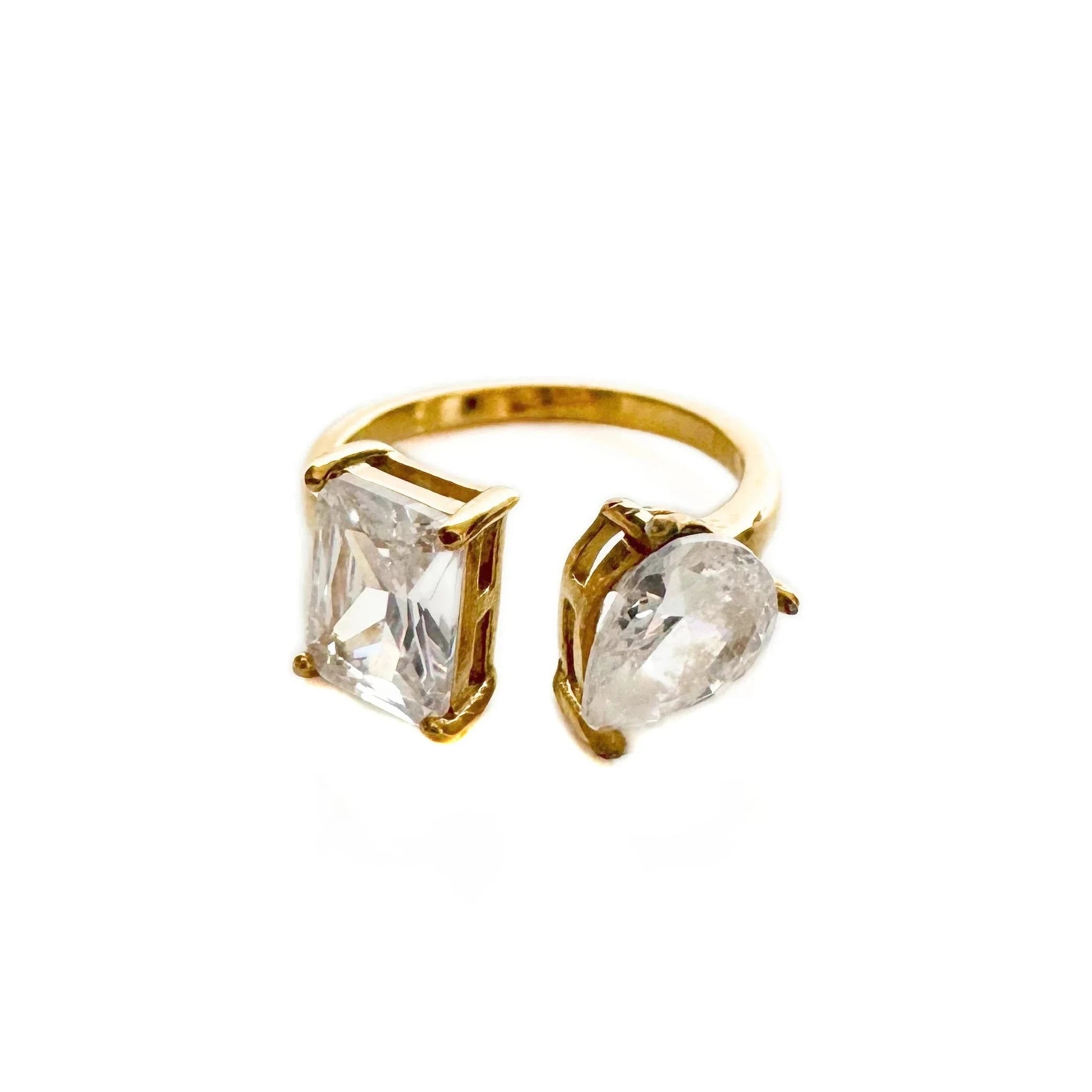 Gold statement ring featuring an oval clear crystal stone
