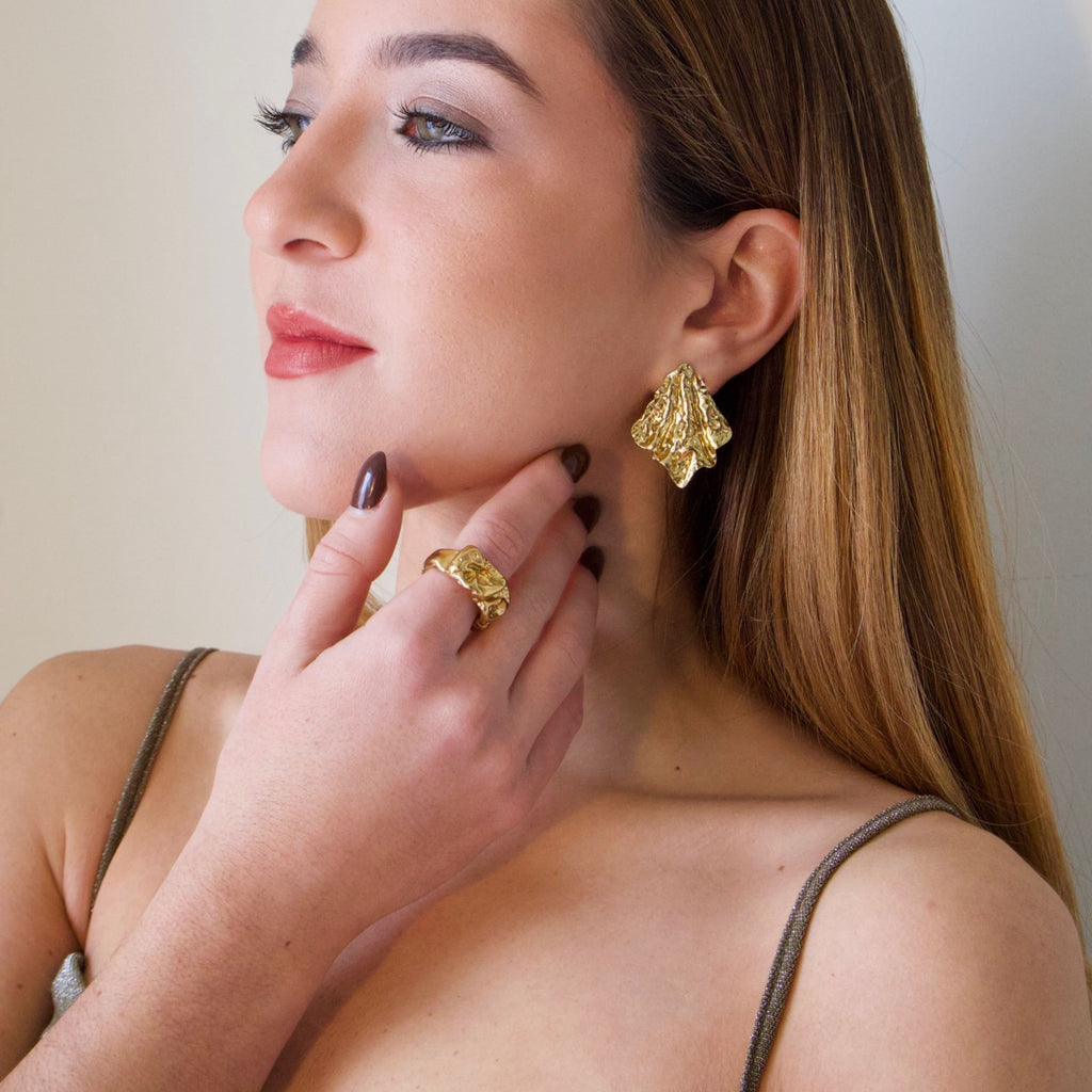 Bold gold statement ring crafted in stainless steel with long-lasting color. A standout piece designed for special occasions and elevated looks.