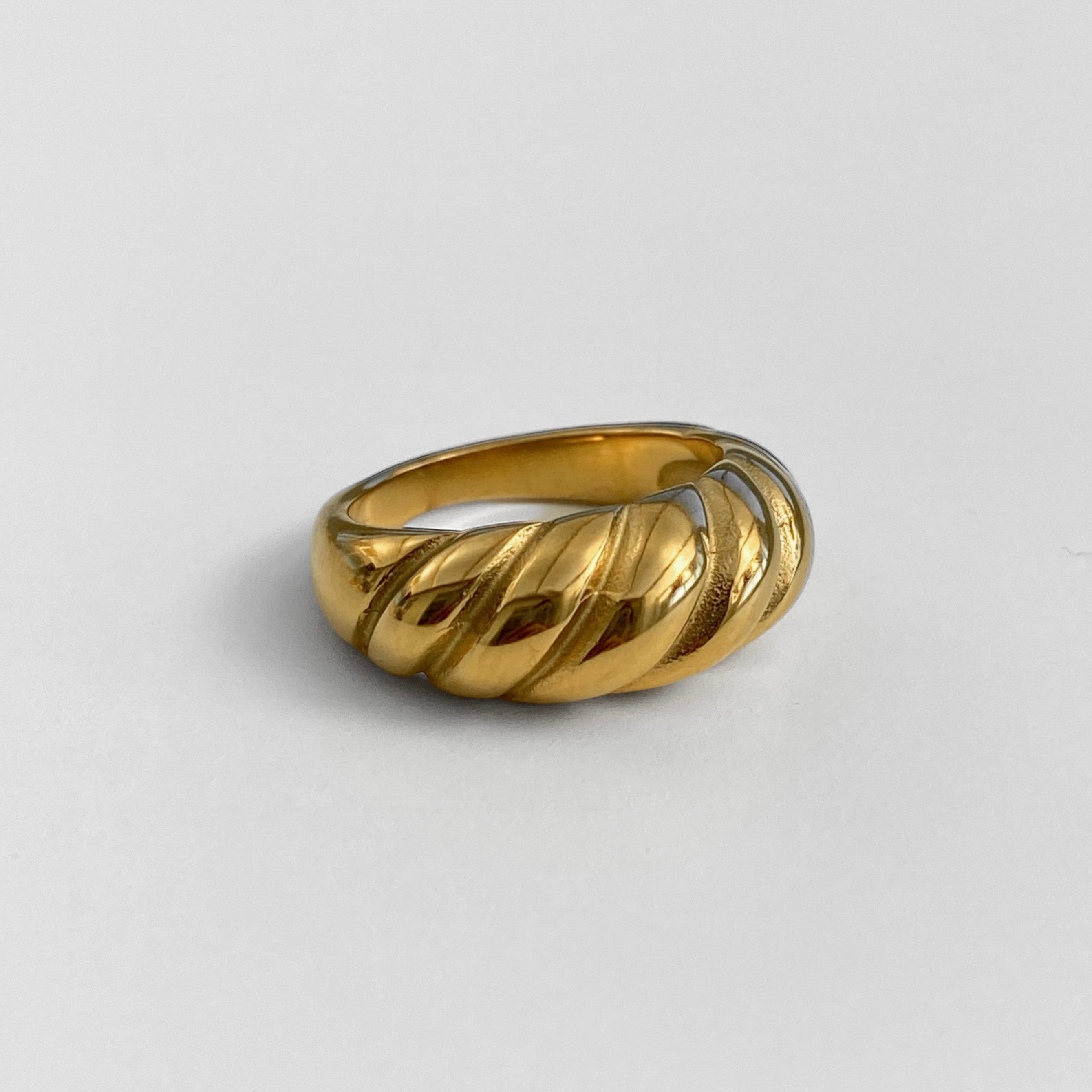 Minimalist gold ring with stainless steel texture and subtle shine