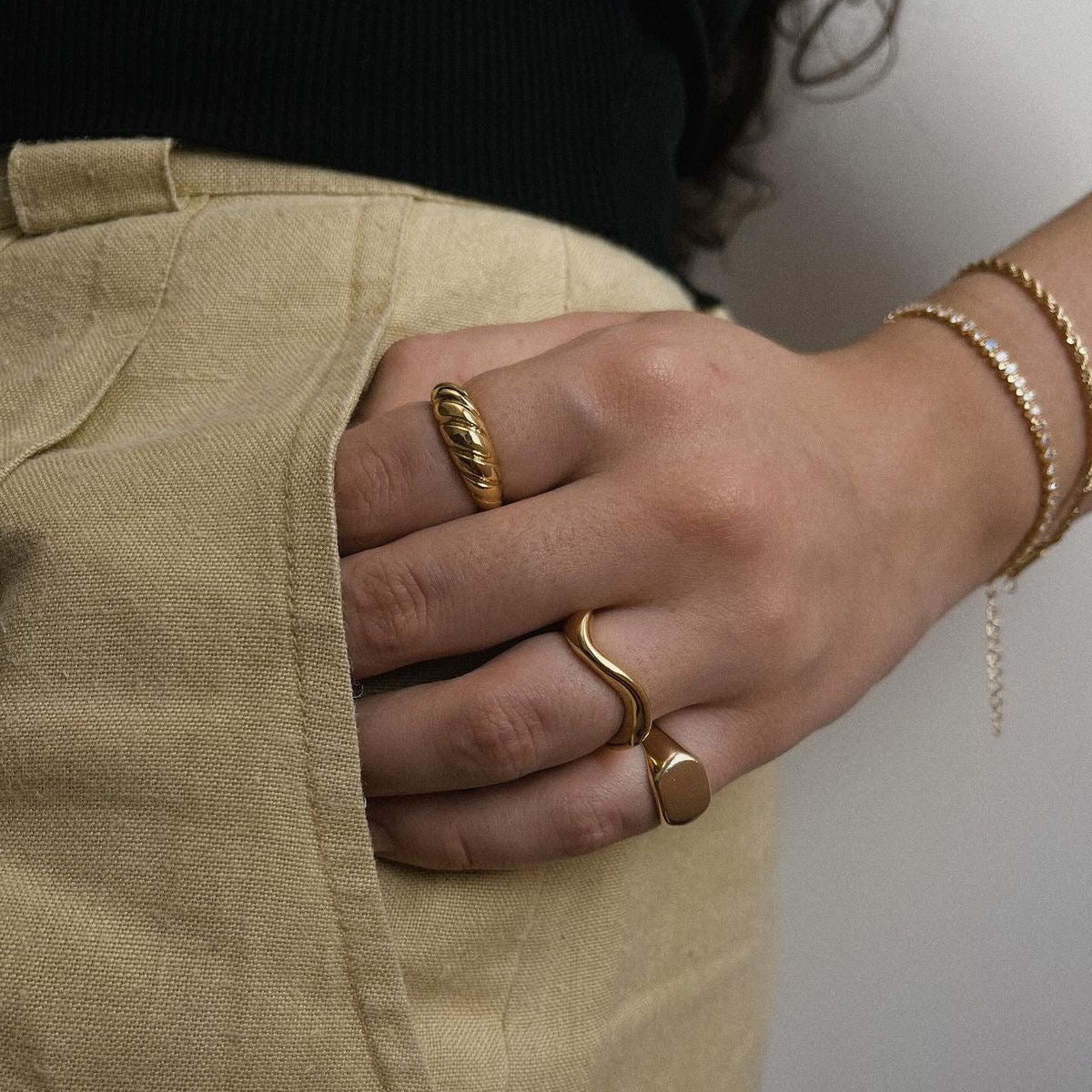 Minimalist gold ring with stainless steel texture and subtle shine