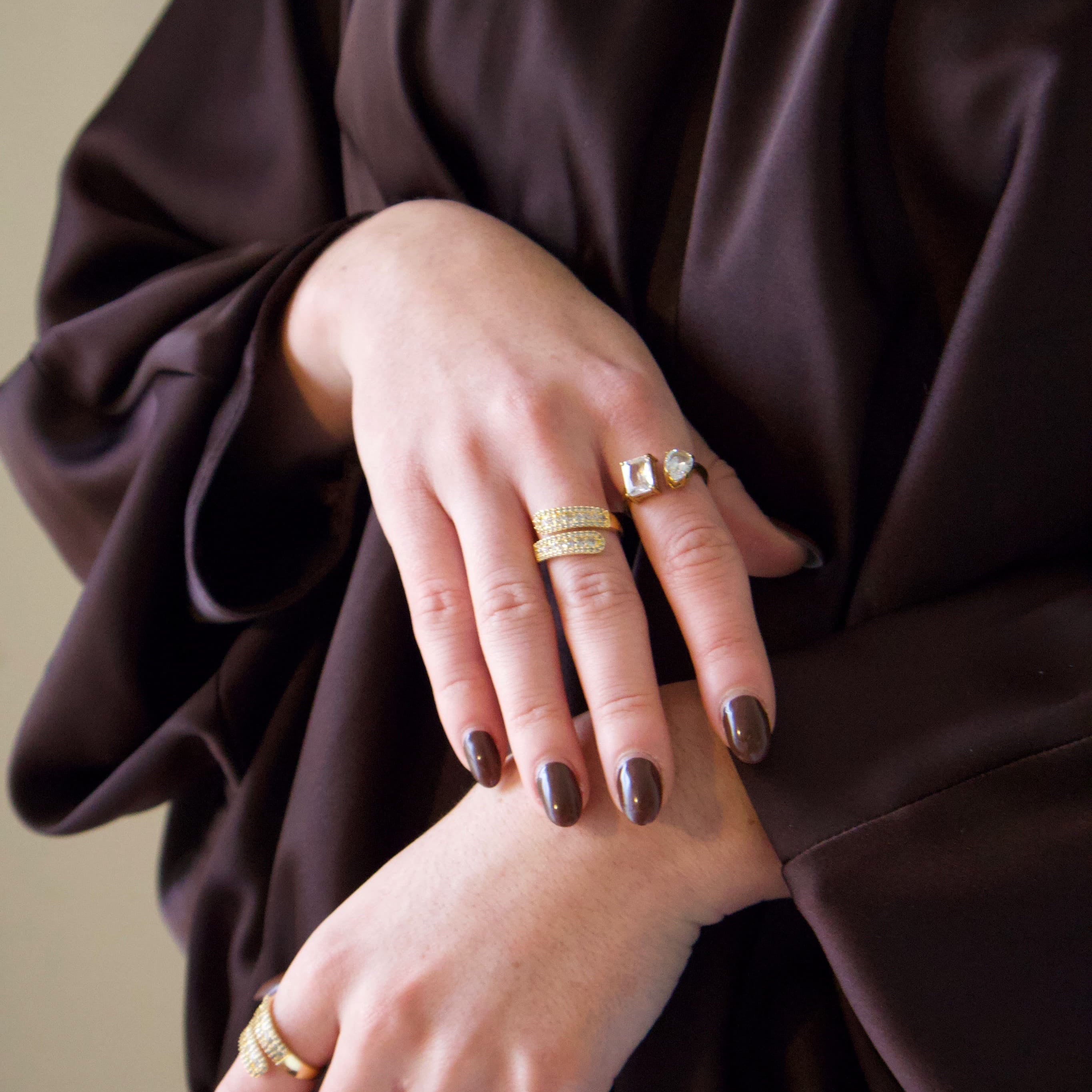 Gold statement ring with pavé detailing in an elegant contemporary design
